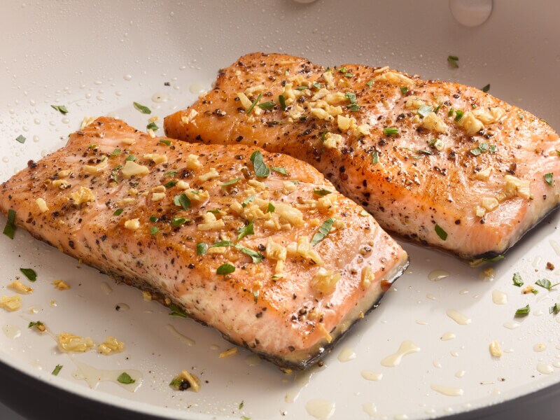 Two seasoned salmon fillets on a plate Two seasoned salmon fillets on a plate