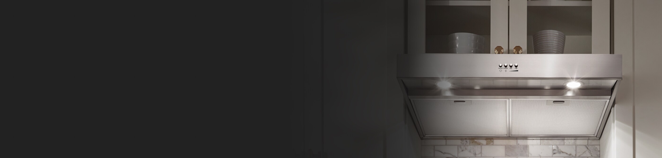 Stainless steel range hood under a cabinet