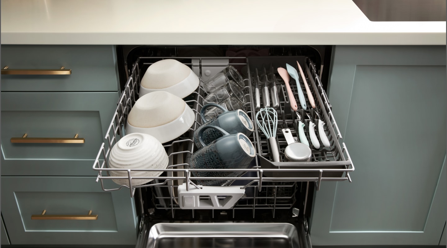 A dishwasher third rack loaded with cups and bowls A dishwasher third rack loaded with cups and bowls