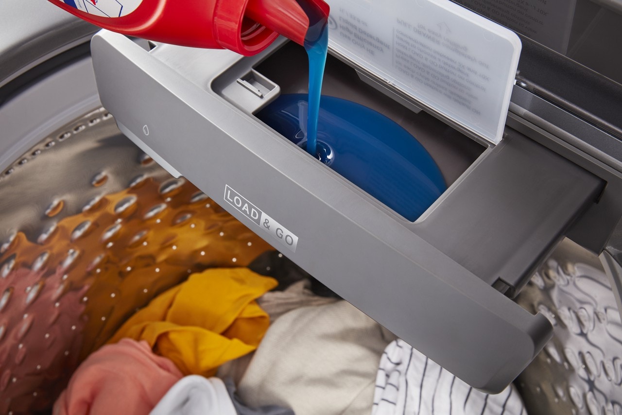 Detergent being poured into a Whirlpool® Load & Go™ Dispenser Detergent being poured into a Whirlpool® Load & Go™ Dispenser