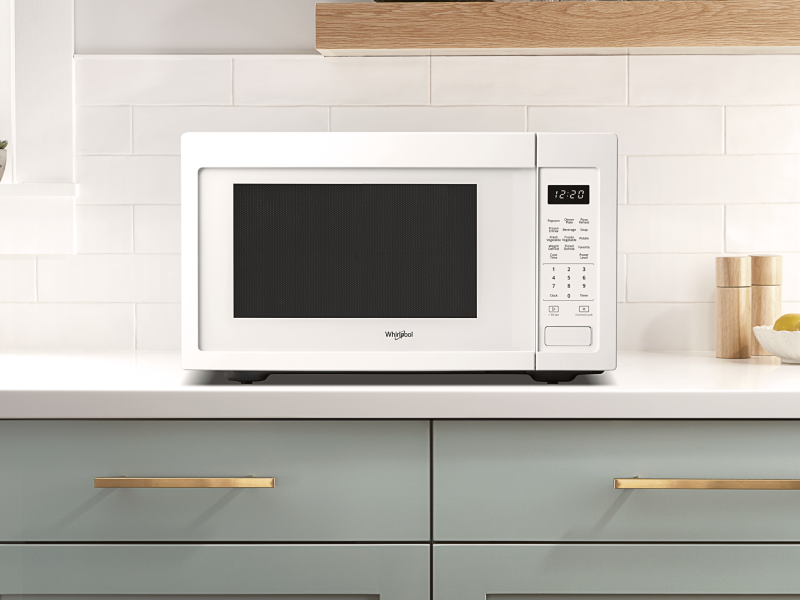 A Whirlpool® Countertop Microwave in a modern kitchen. A Whirlpool® Countertop Microwave in a modern kitchen.
