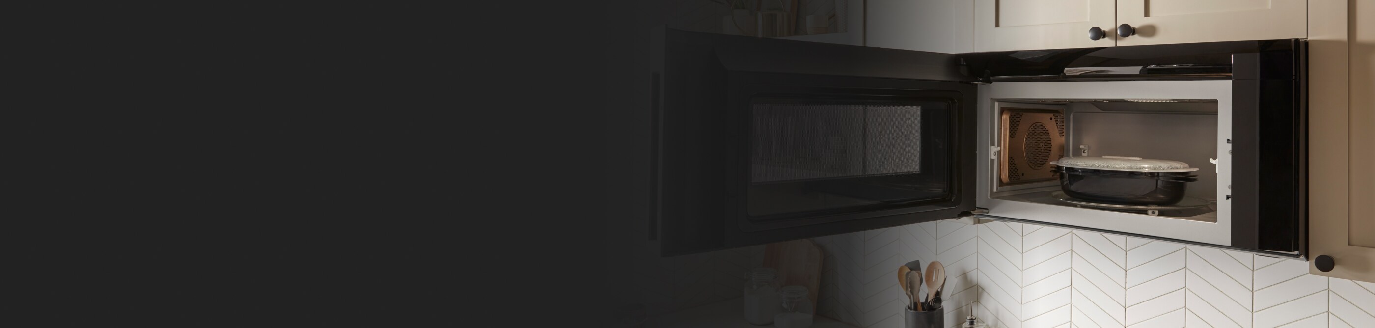 Whirlpool® microwave open to show contents