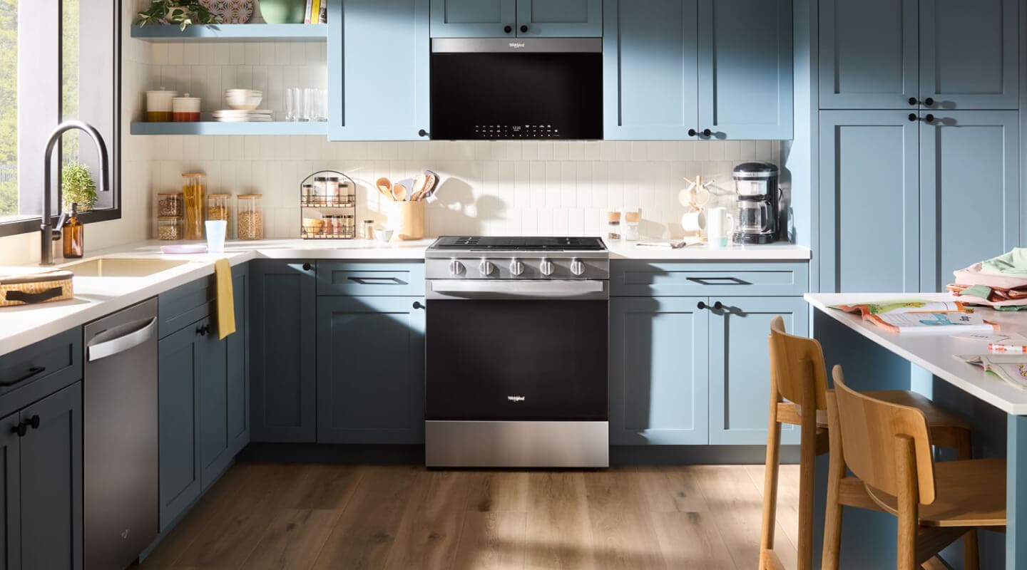 A kitchen with an over-the-range microwave A kitchen with an over-the-range microwave