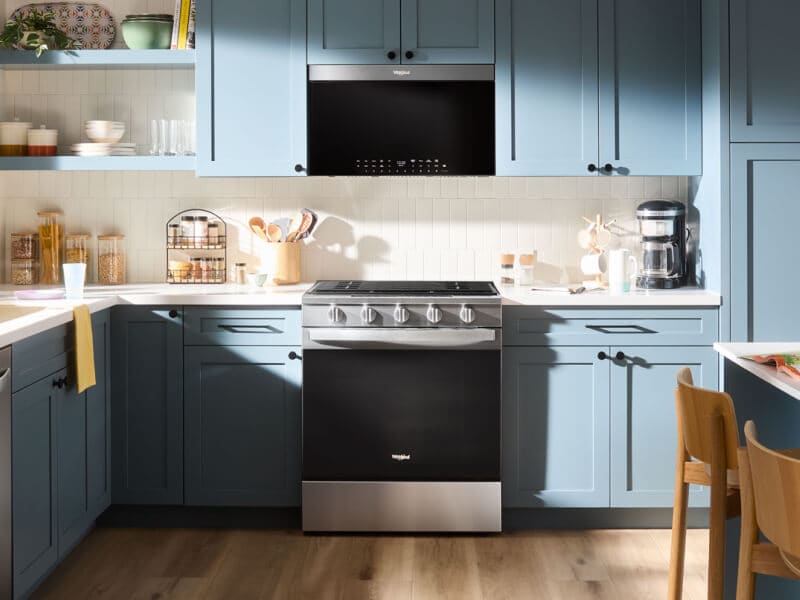 A kitchen with an over-the-range microwave A kitchen with an over-the-range microwave