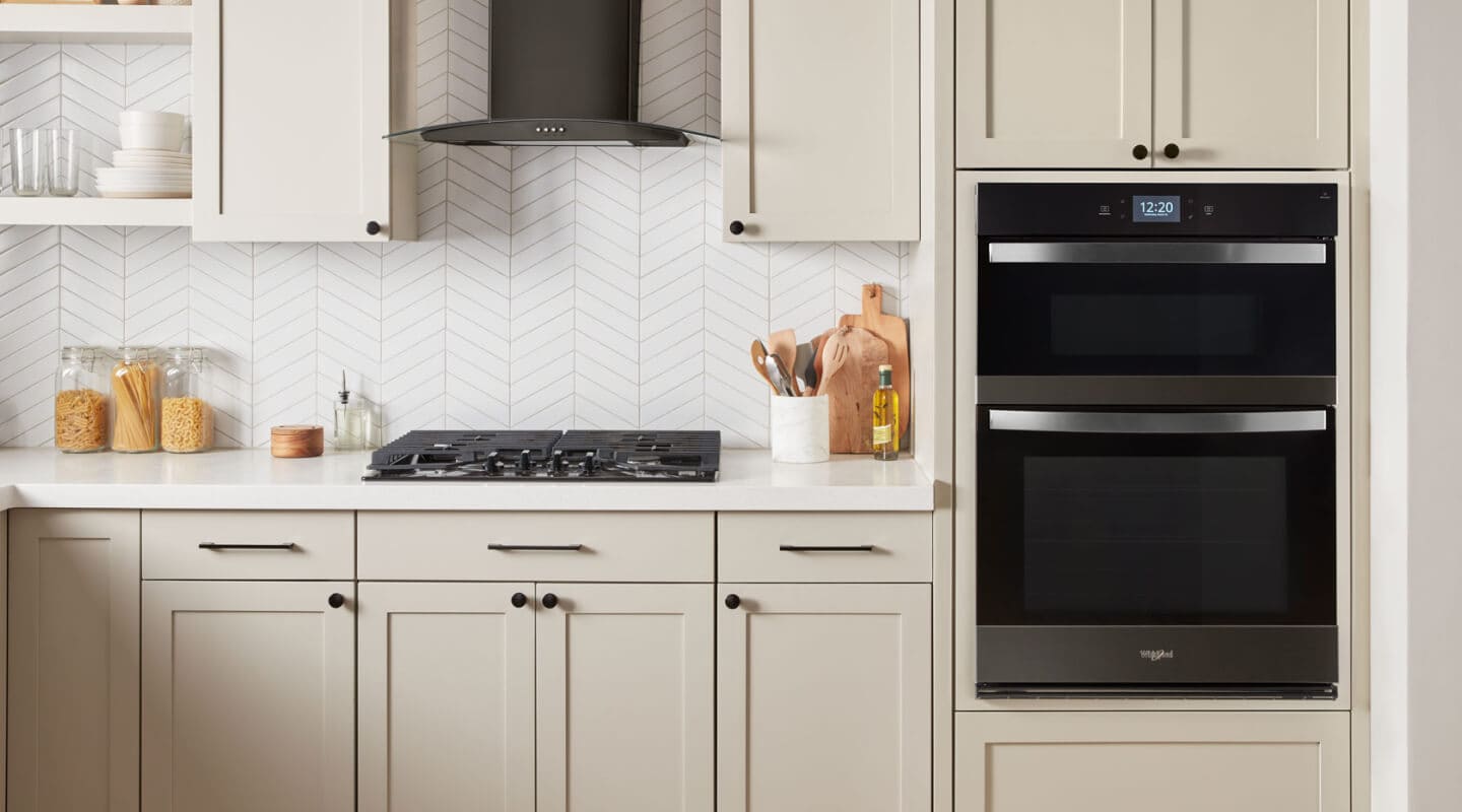 A kitchen with a microwave oven combo A kitchen with a microwave oven combo