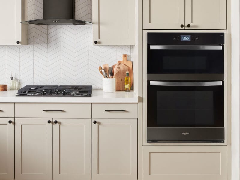A kitchen with a microwave oven combo A kitchen with a microwave oven combo