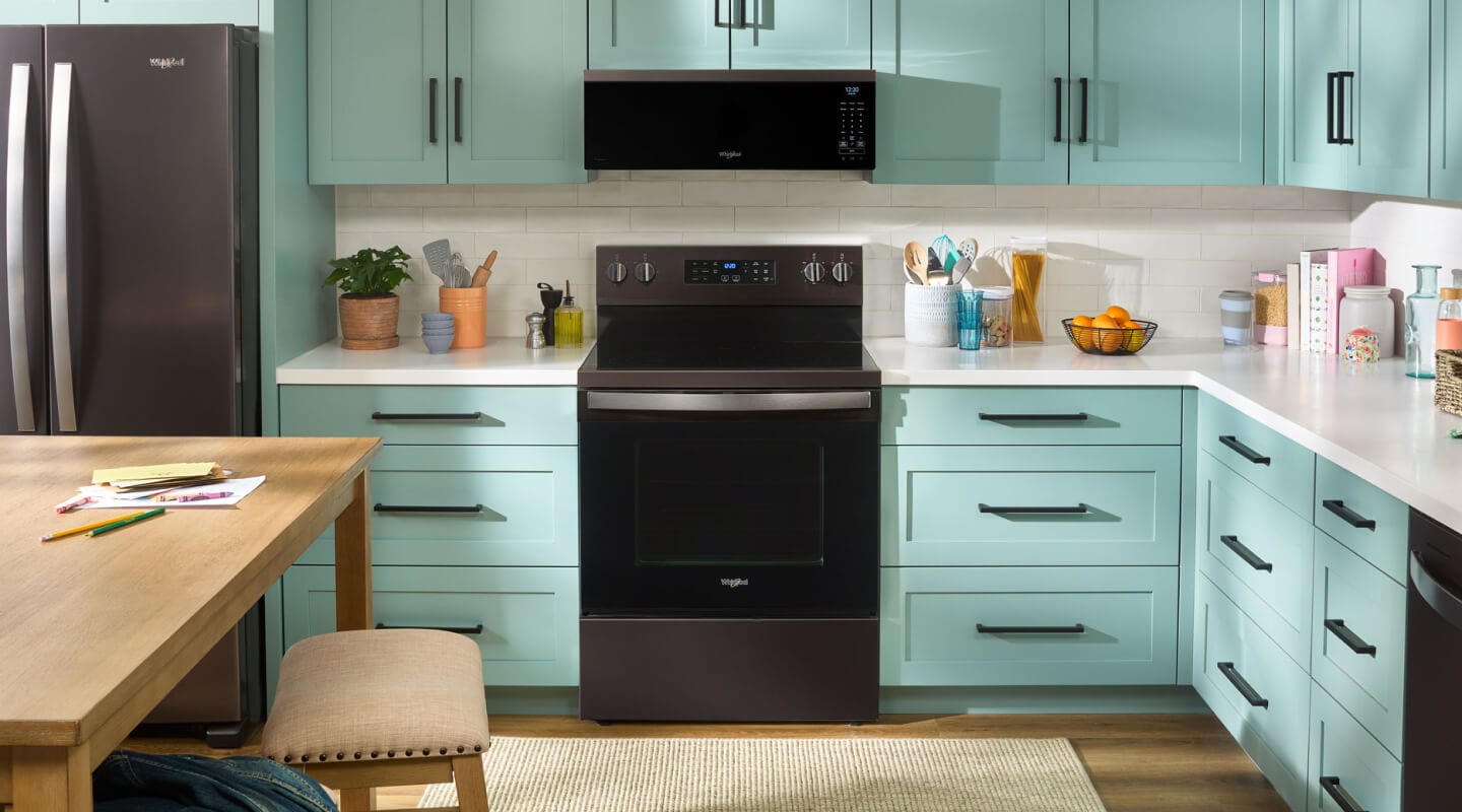 A kitchen with an over-the-range microwave A kitchen with an over-the-range microwave