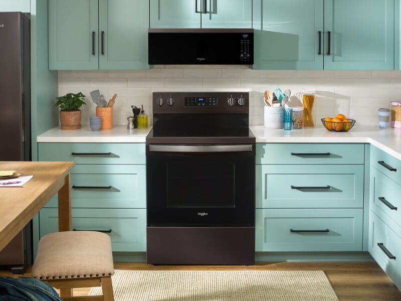 A kitchen with an over-the-range microwave A kitchen with an over-the-range microwave