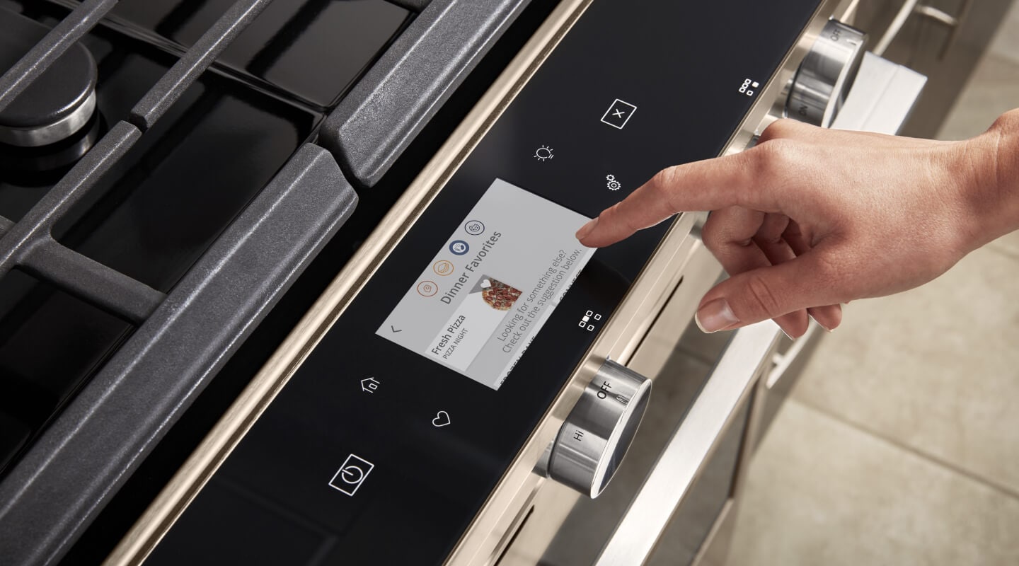 Person selecting touch screen settings on a gas oven Person selecting touch screen settings on a gas oven