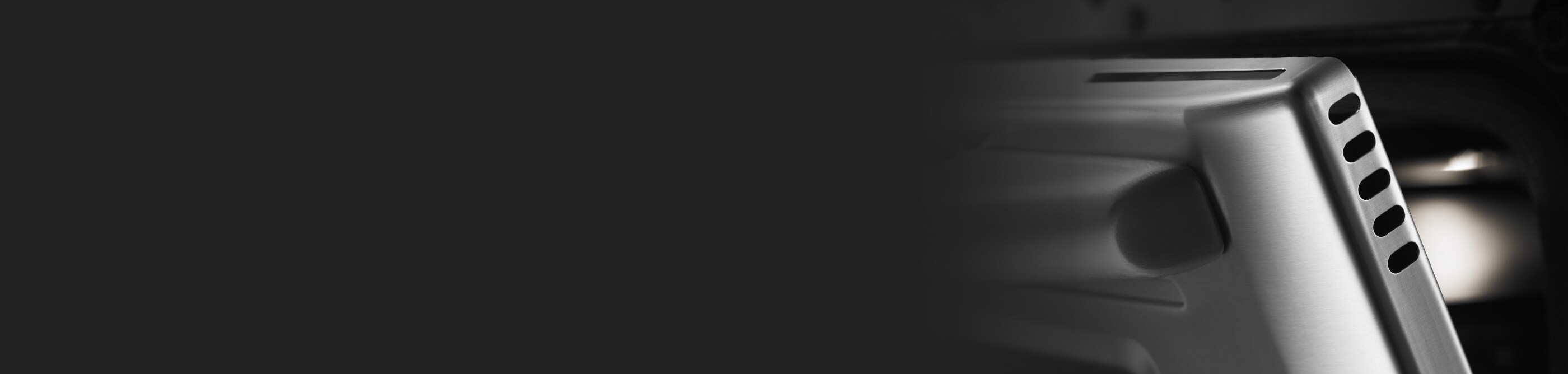 Close-up of an oven door slightly open