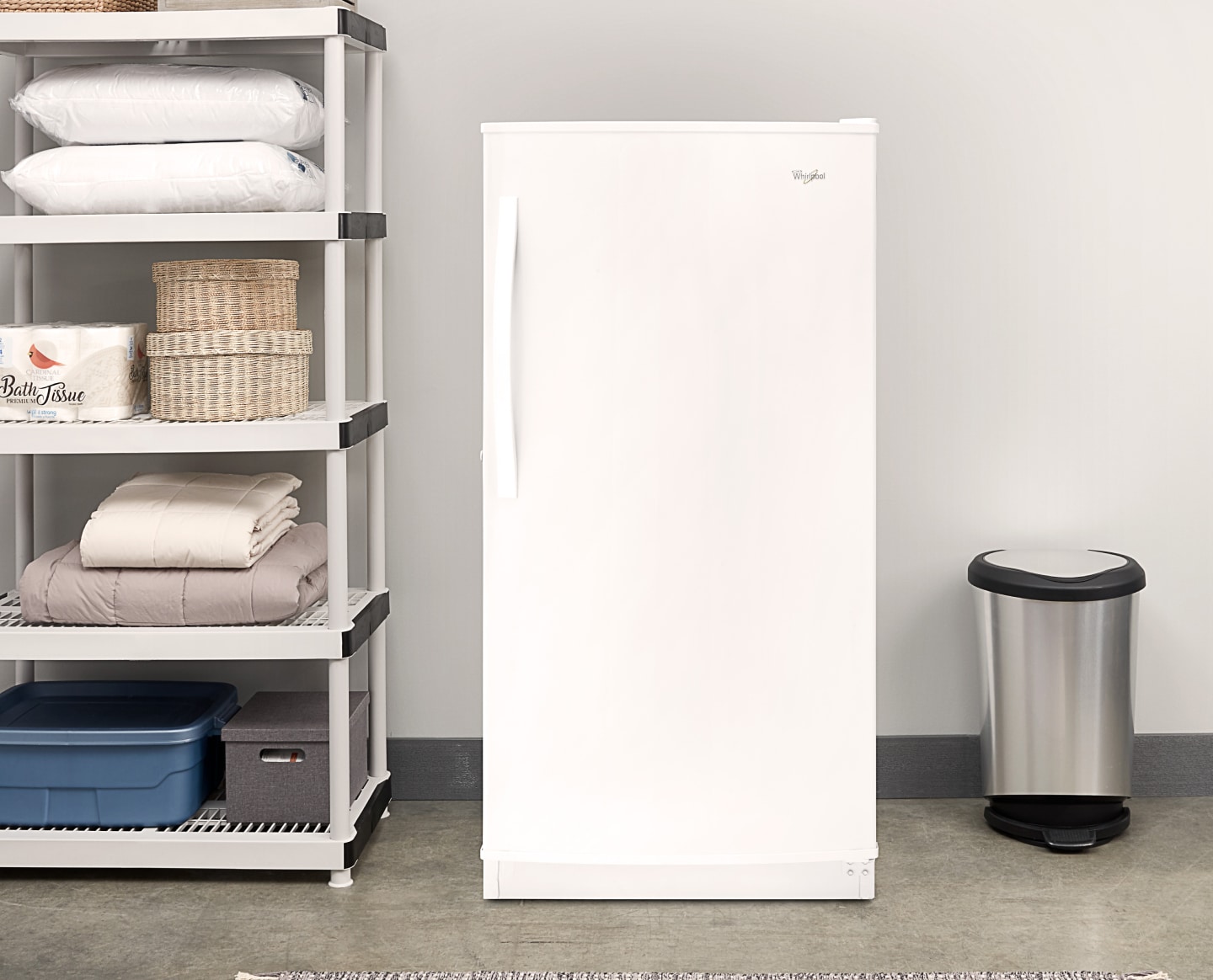 A white Whirlpool® All Refrigerator in a laundry room