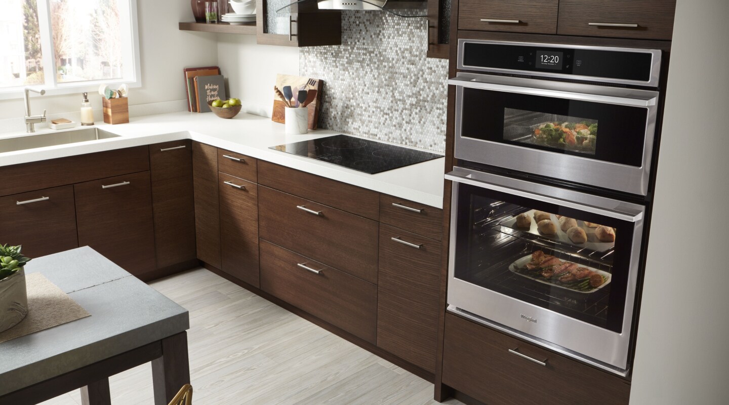 A double-wall oven cooking multiple dishes