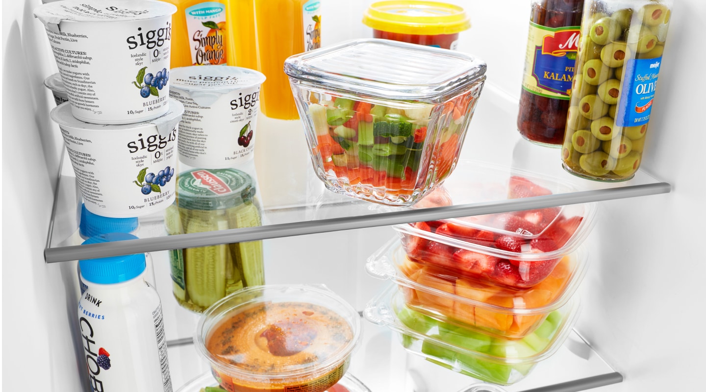 Stocked refrigerator shelves Stocked refrigerator shelves