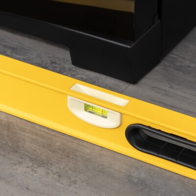 Close-up of leveler in front of refrigerator