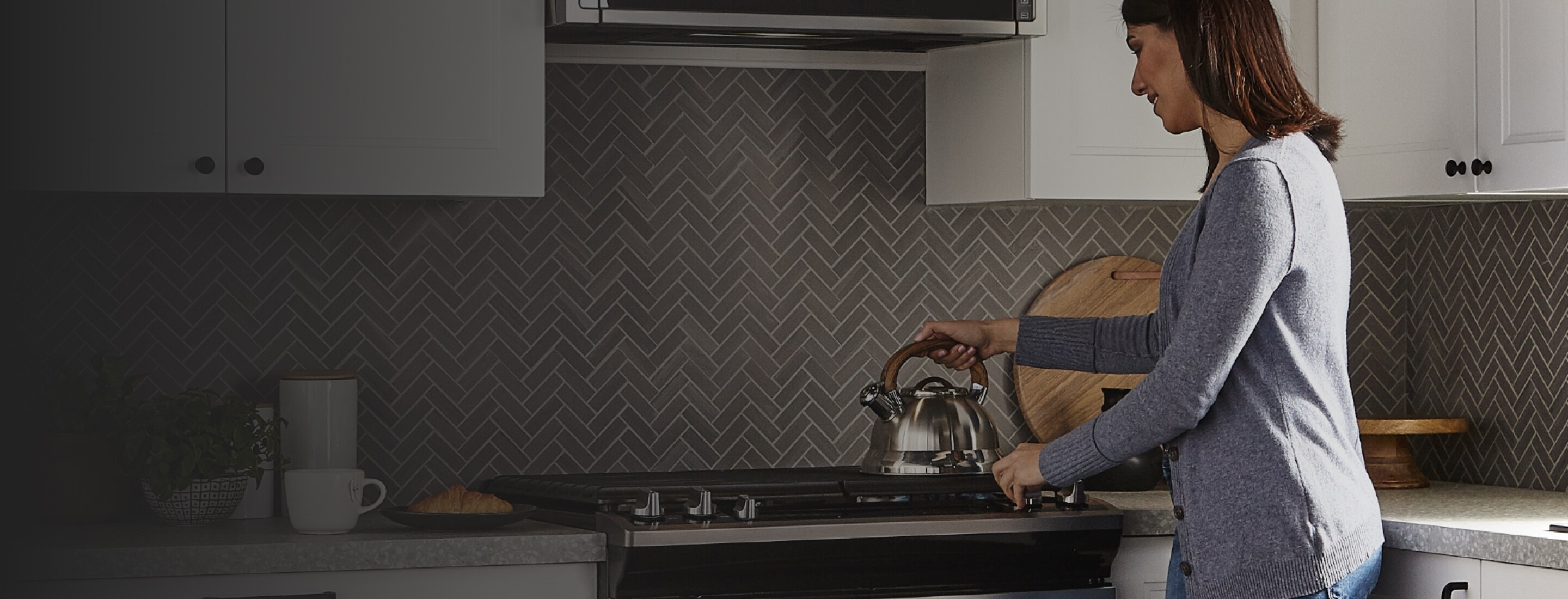 Putting a kettle on to boil.