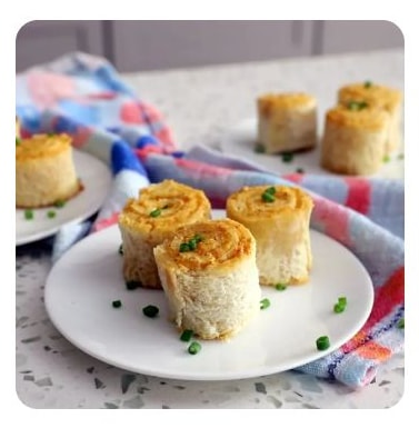 A plate of three grilled cheese pin wheels A plate of three grilled cheese pin wheels