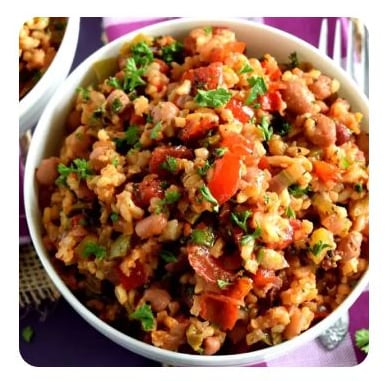 A bowl filled with rice, bean and vegetable jambalaya