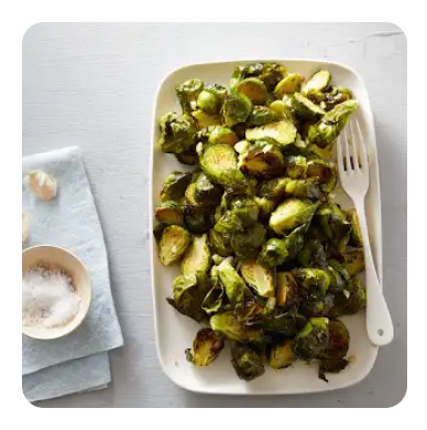 Roasted Brussels sprouts on a white serving dish