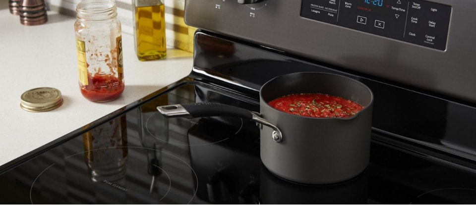 Spaghetti sauce in a pot on a cooktop Spaghetti sauce in a pot on a cooktop