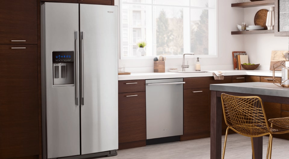 A side-by-side refrigerator in a kitchen A side-by-side refrigerator in a kitchen