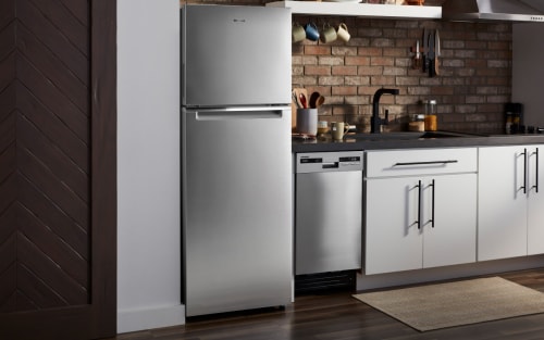 Stainless steel Whirlpool® Top Freezer Refrigerator in compact kitchen