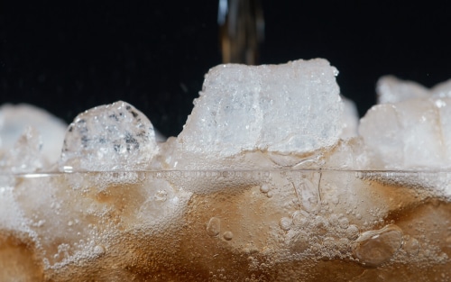 Nugget ice in a glass of soda