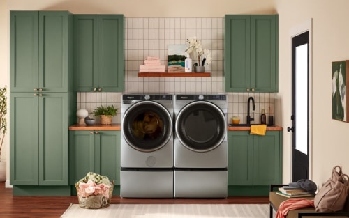 A laundry room with a front load washer and dryer pair