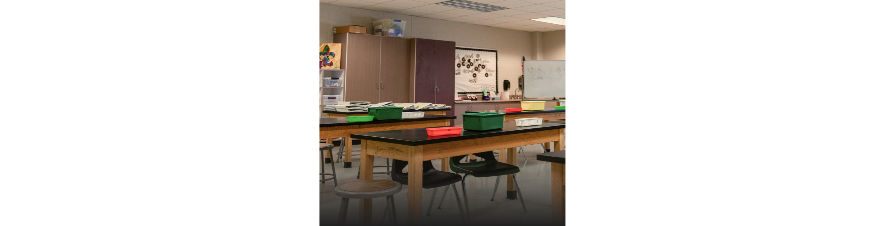 A row of empty desks in a school classroom