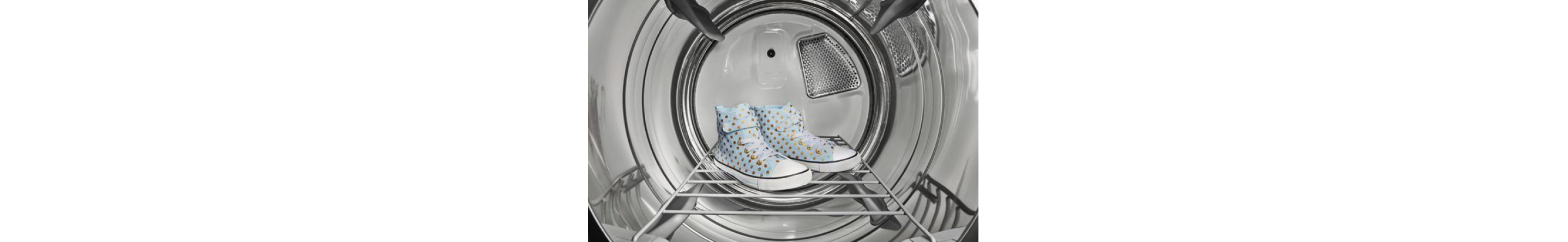 A pair of sneakers sitting on a rack inside a dryer
