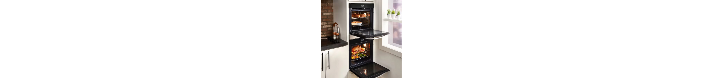  A black double oven set in white cabinetry
