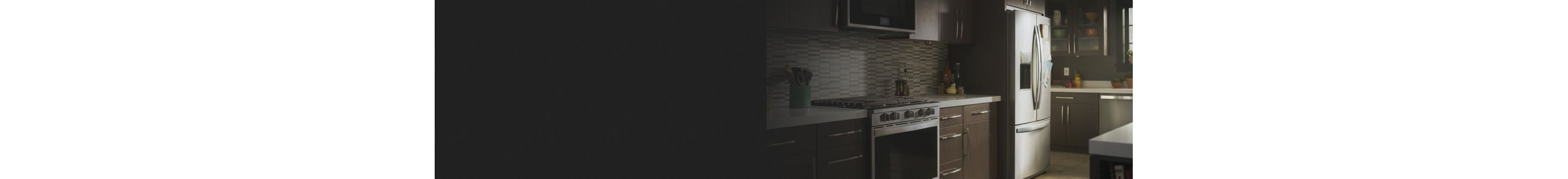 A kitchen with brown cabinets and stainless steel appliances