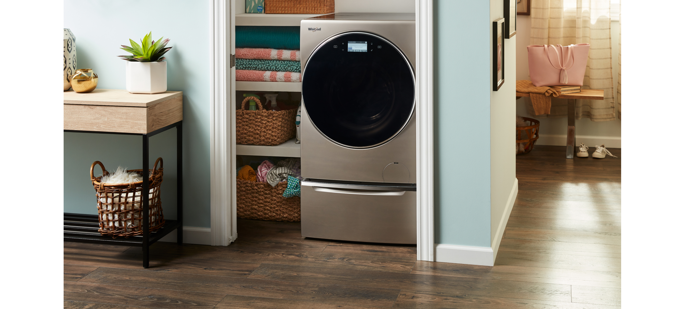 An all-in-one washer and dryer placed in a laundry closet.