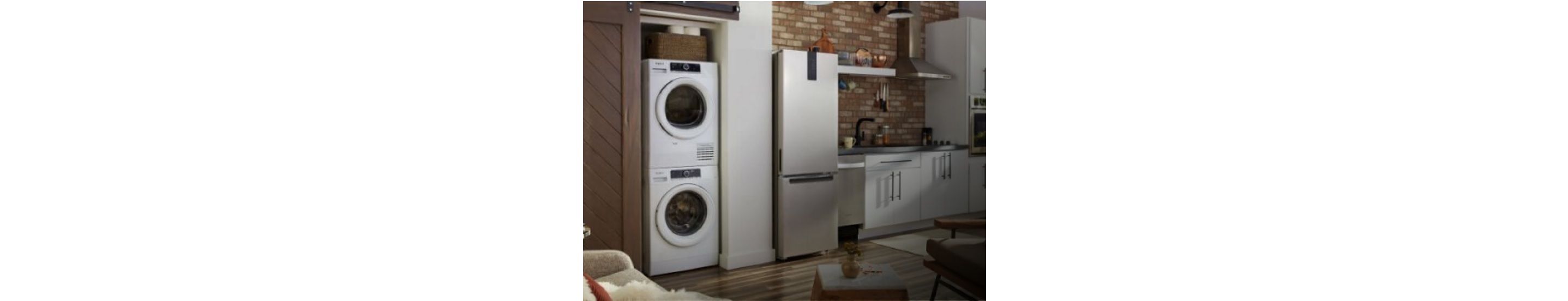 A kitchen with light cabinets and small space appliances