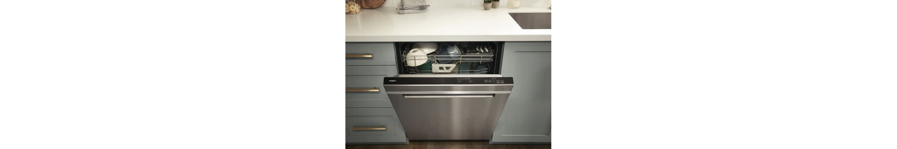 A Whirlpool® Dishwasher with the door slightly open, showing the 3rd Rack