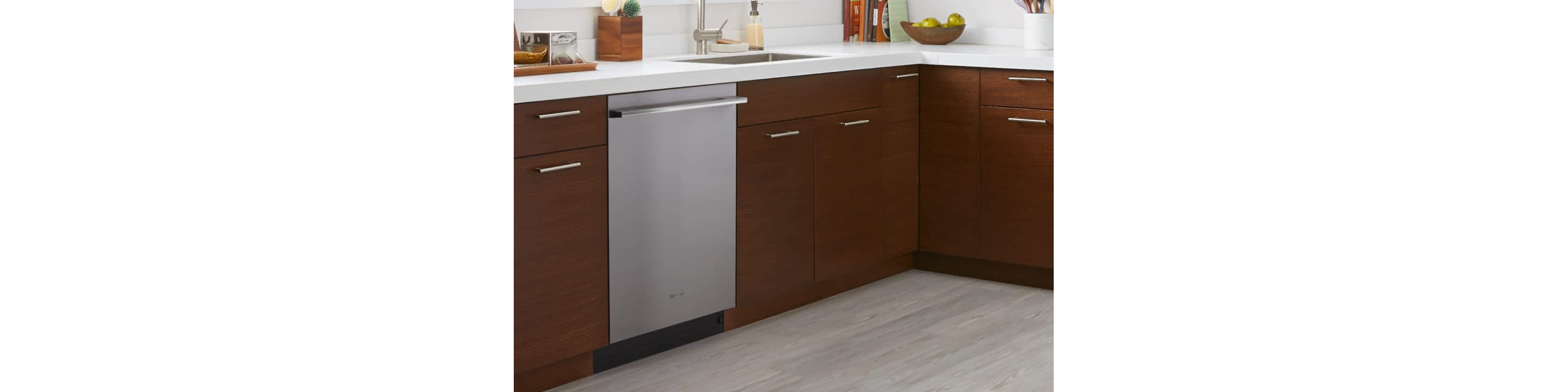 A Whirlpool® Dishwasher in a kitchen with brown cabinets