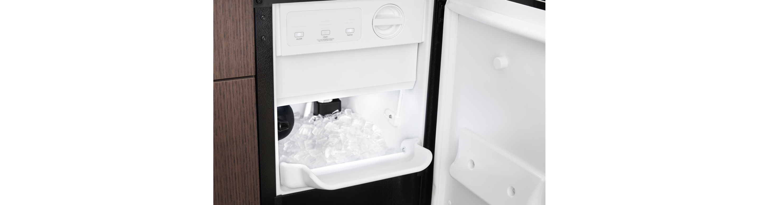 Whirlpool® Ice Maker open to show ice inside
