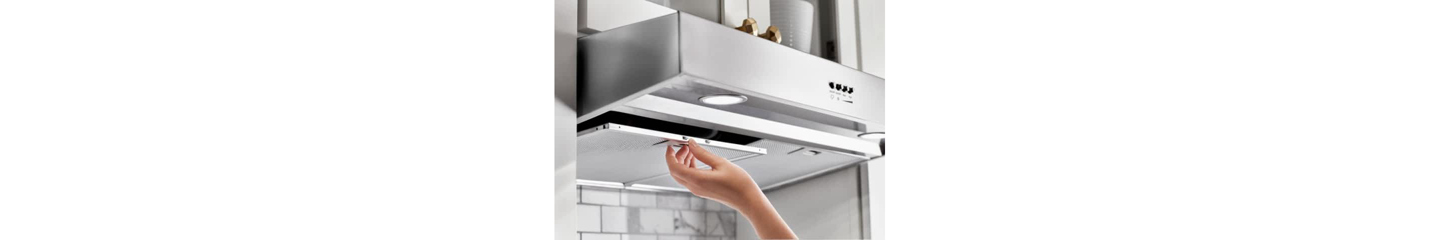 Hand removing a grease filter from an undercabinet hood