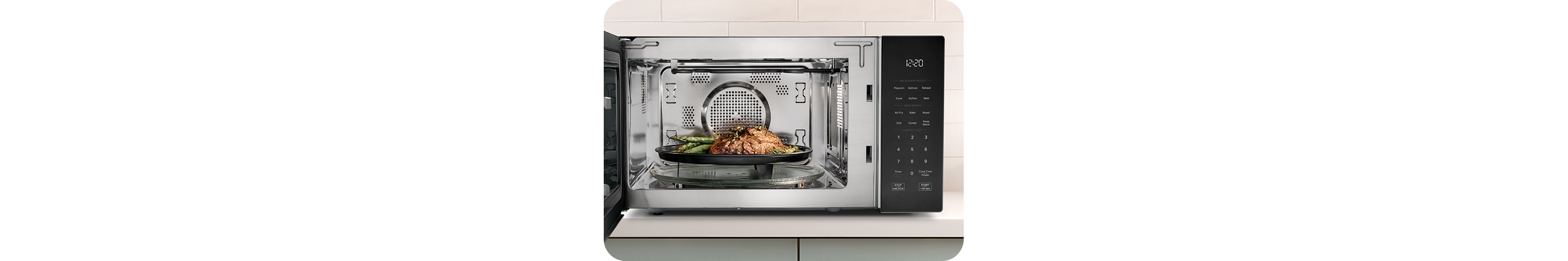 Steak and asparagus grilling inside a Whirlpool® Microwave