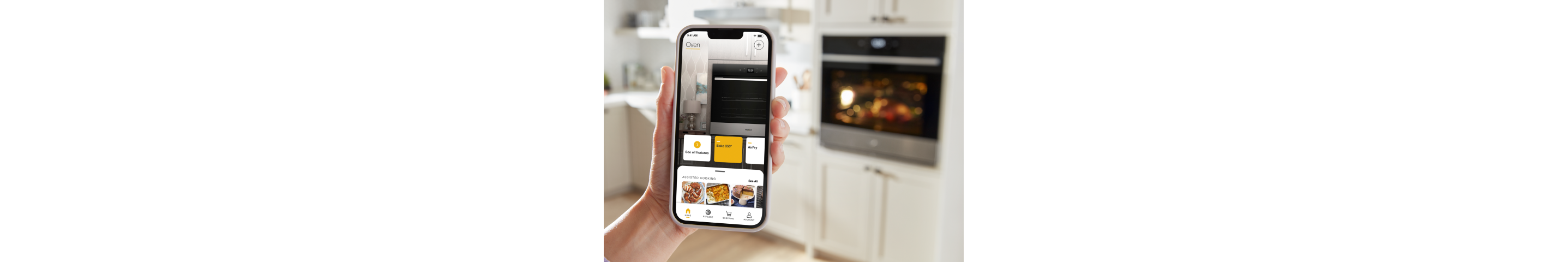 A hand holding a phone displaying the Whirlpool® App