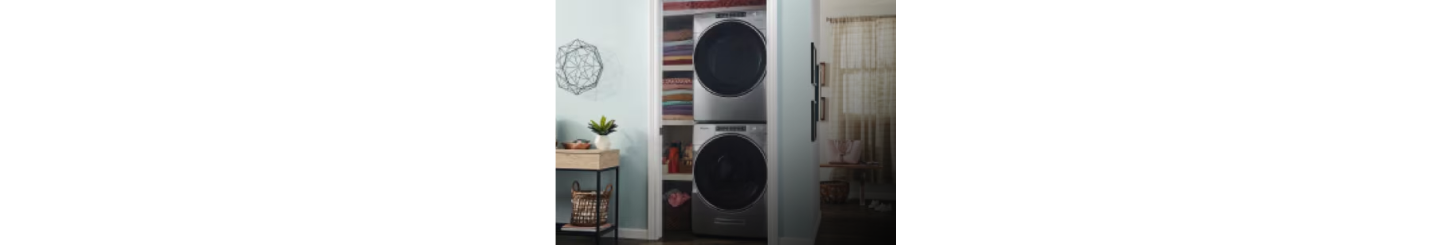 A stacked Whirlpool® washer and dryer in a closet