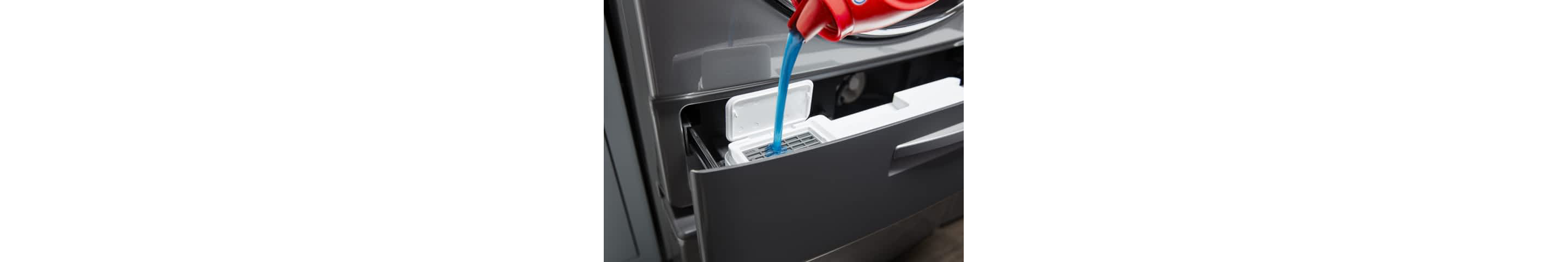 Blue laundry detergent being poured into a Load & Go™ Dispenser