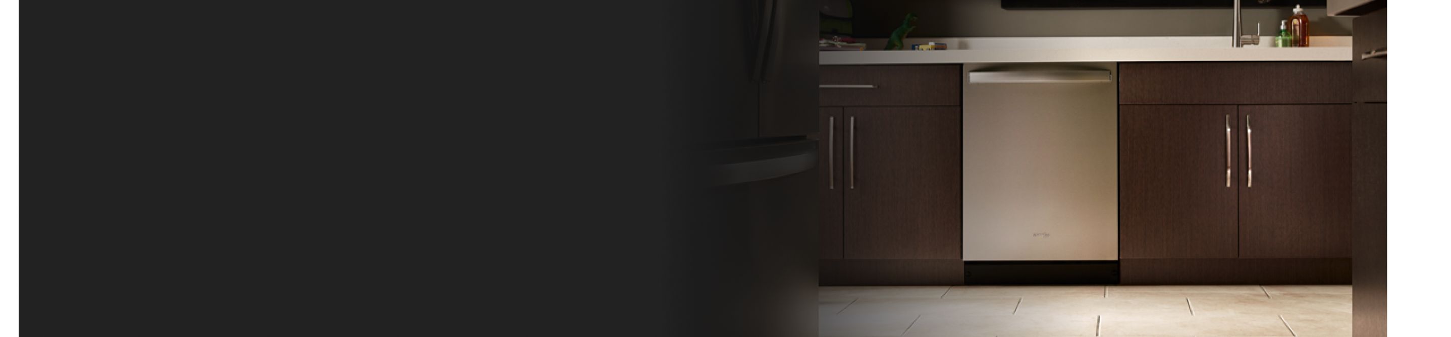 A stainless steel dishwasher in a modern kitchen.
