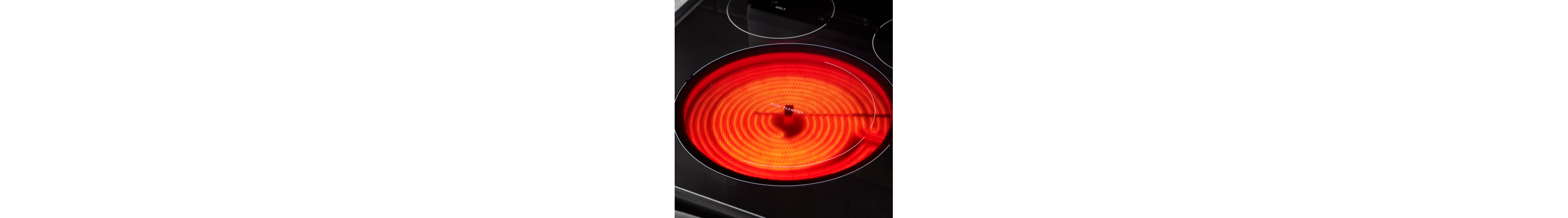 A red radiant heating element on an electric stove.