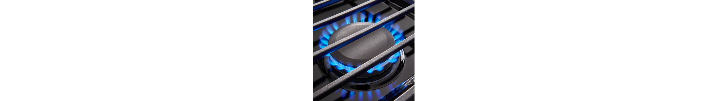 Gas burners ignited with blue flames.