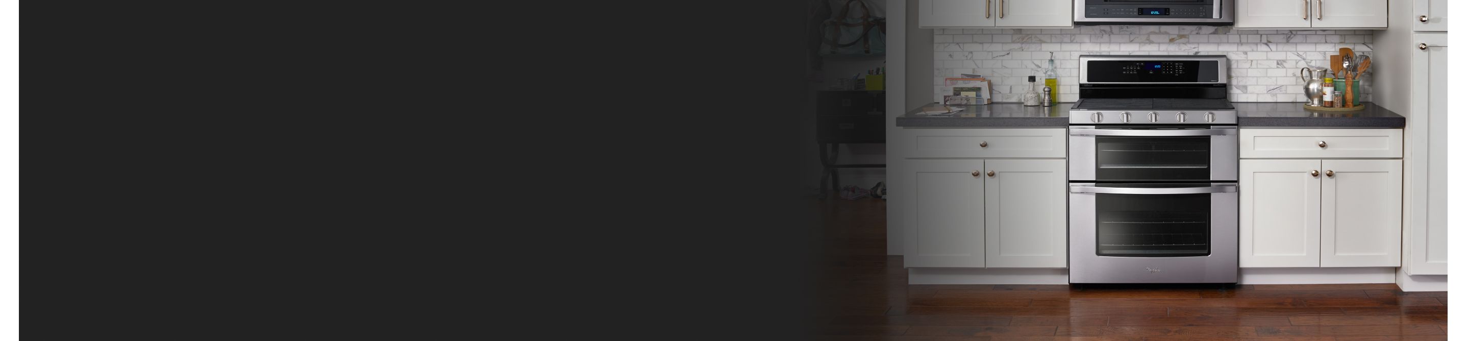 A Whirlpool® range surrounded by white cabinetry.