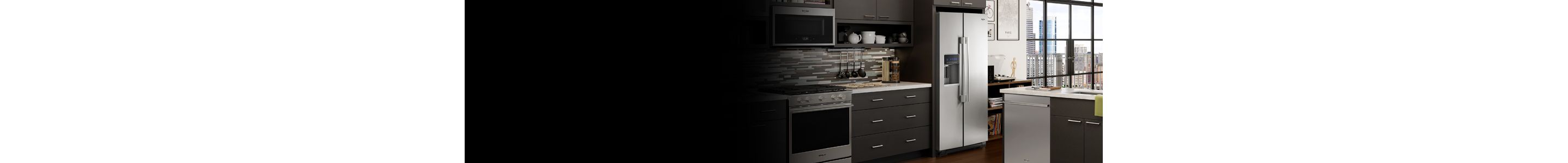 A sleek kitchen featuring a Whirlpool® stainless steel refrigerator.