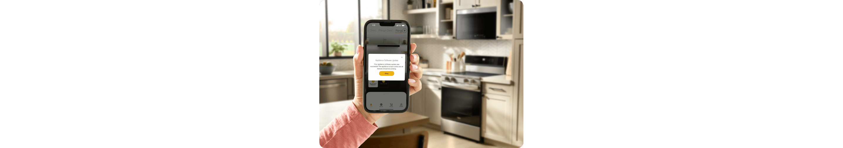 A hand holding the Whirlpool® App showing an update for the Whirlpool® Smart Range