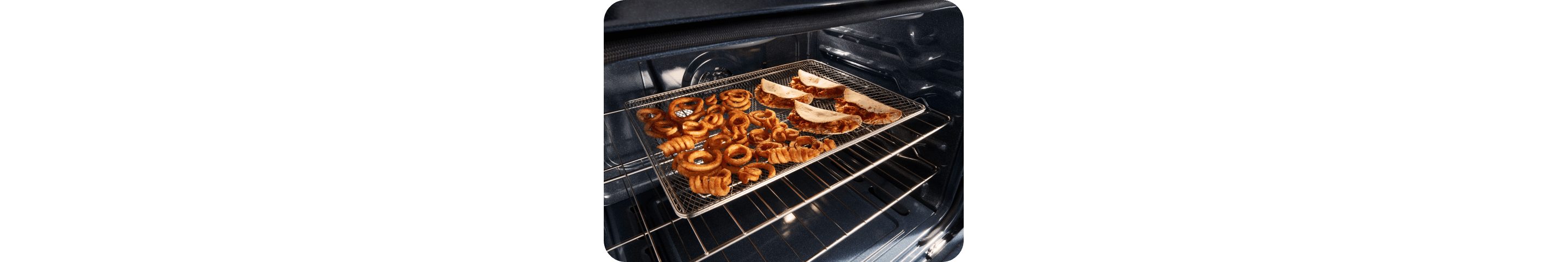 Curly fries and quesadillas being air fried in the oven