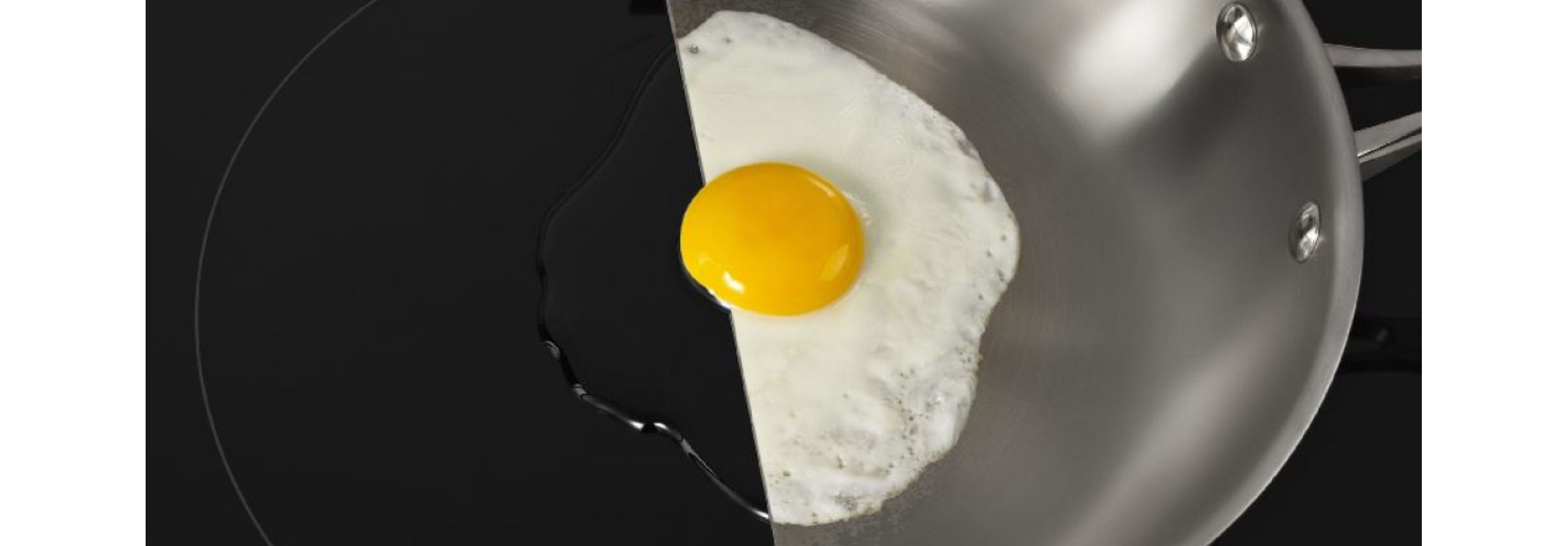 An egg simmering in a pan