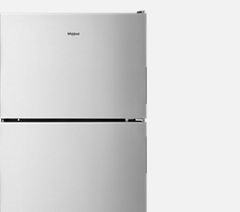 Top-freezer refrigerator from Whirlpool with open doors.